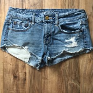 Distressed Mid Rise American Eagle shorts size 4